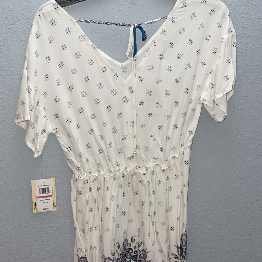 white dress with blue flower pattern